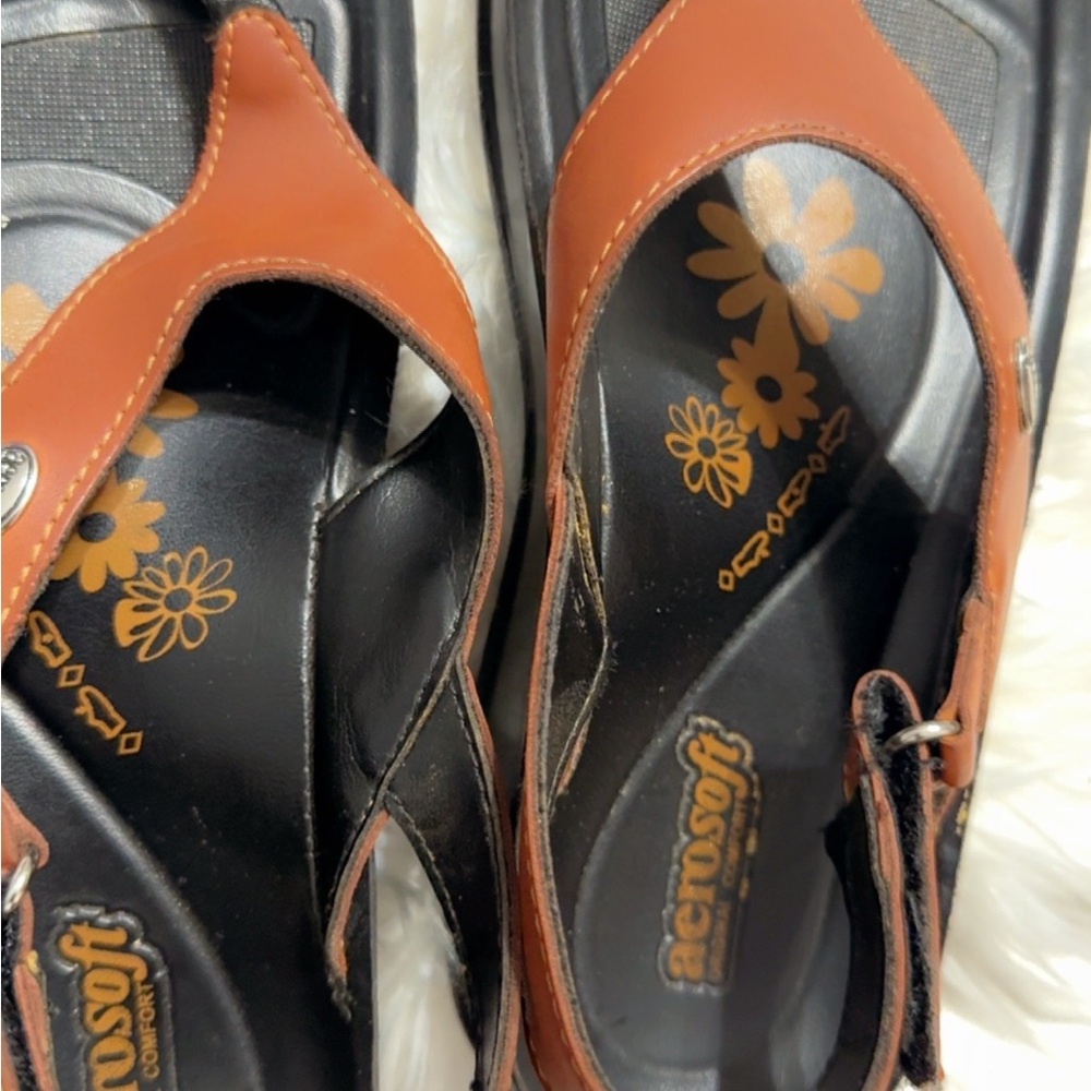 Elegant Brown and Black Sandals with Modern Comfort
